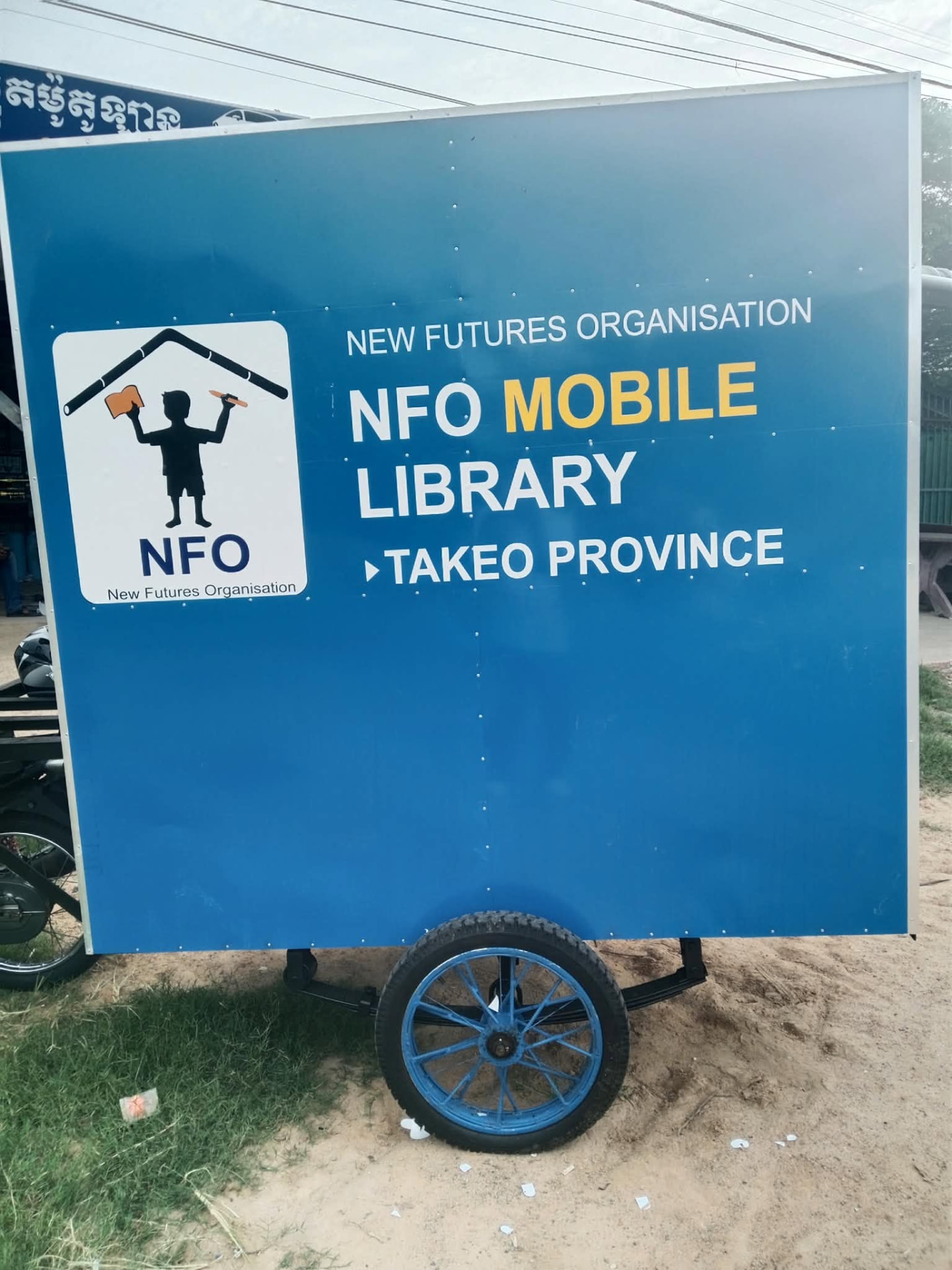 The blue NFO Mobile Library trailer branded for Takeo Province